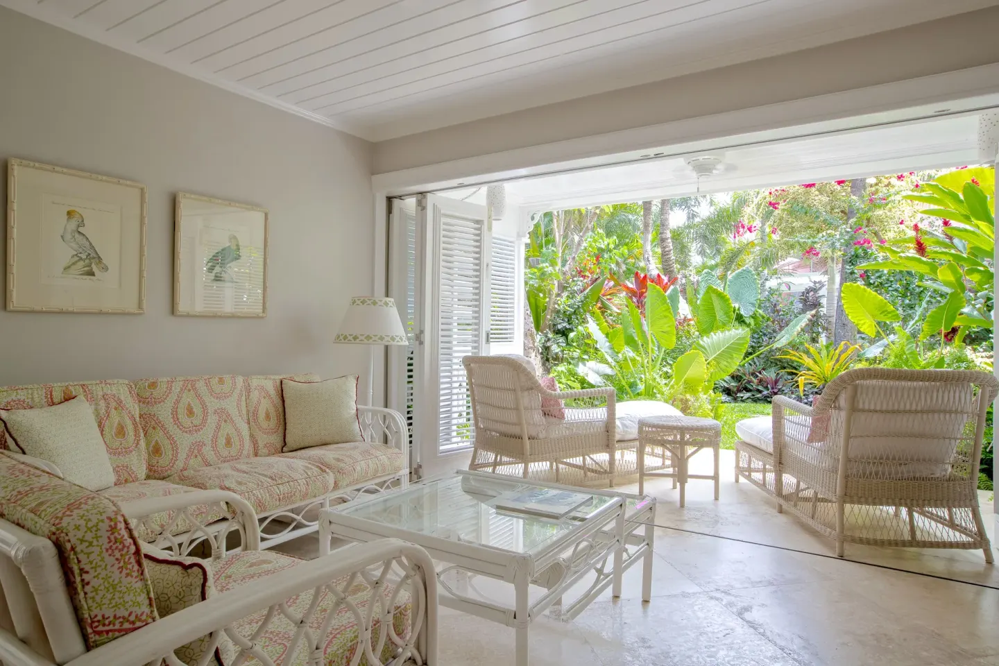 Upper Circle Suite lounge with open shutters to a garden terrace at Cobblers Cove.