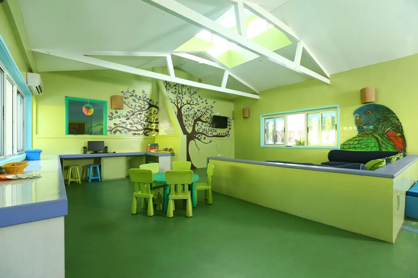 Bright children's playroom with murals at Coconut Bay Beach Resort & Spa.