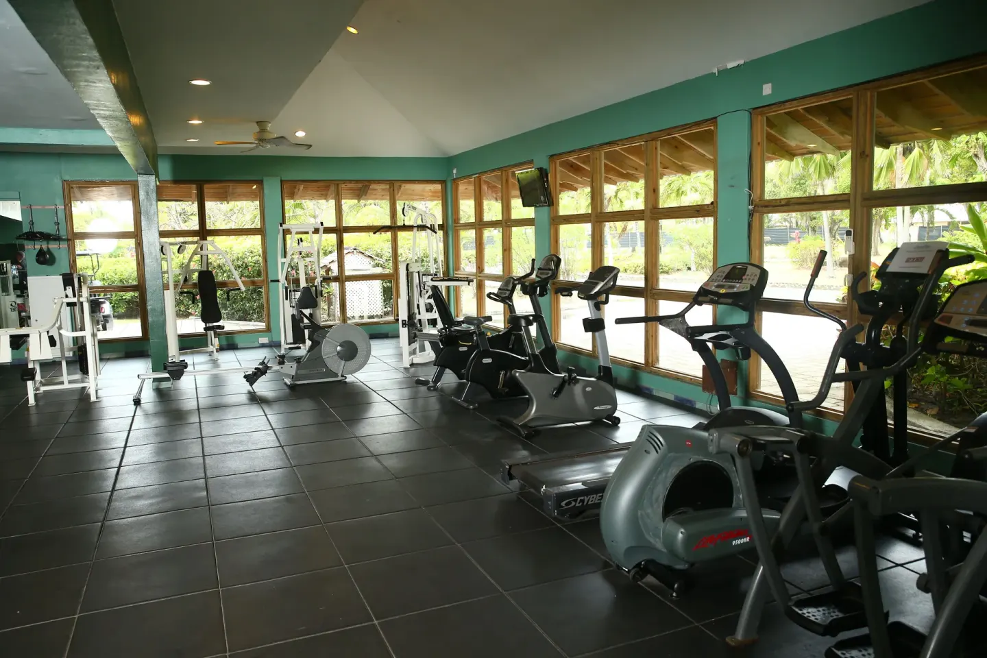 Fitness center with cardio and weight equipment at Coconut Bay Beach Resort & Spa.