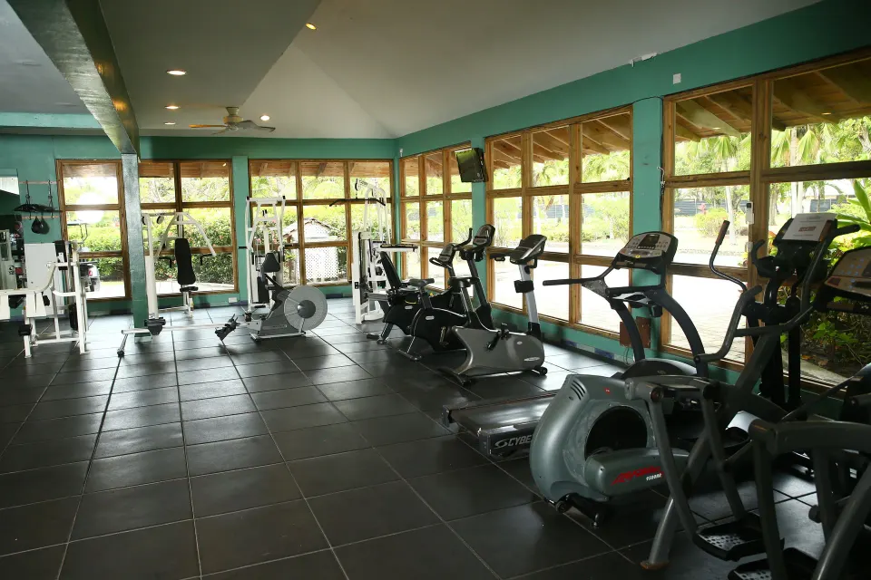 Fitness center with cardio and weight equipment at Coconut Bay Beach Resort & Spa.