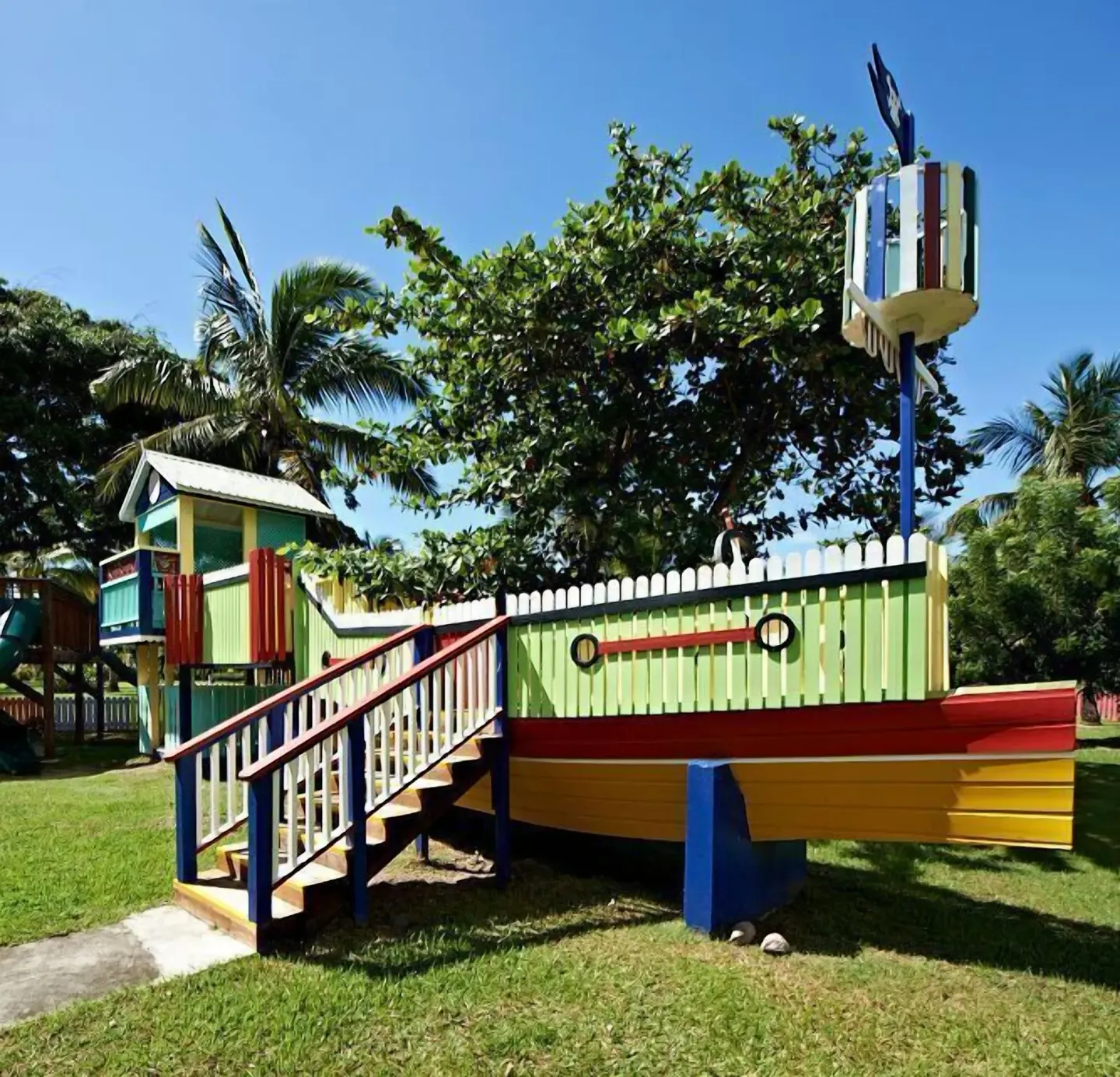 Colorful ship-themed playground on the lawn at Coconut Bay Beach Resort & Spa.