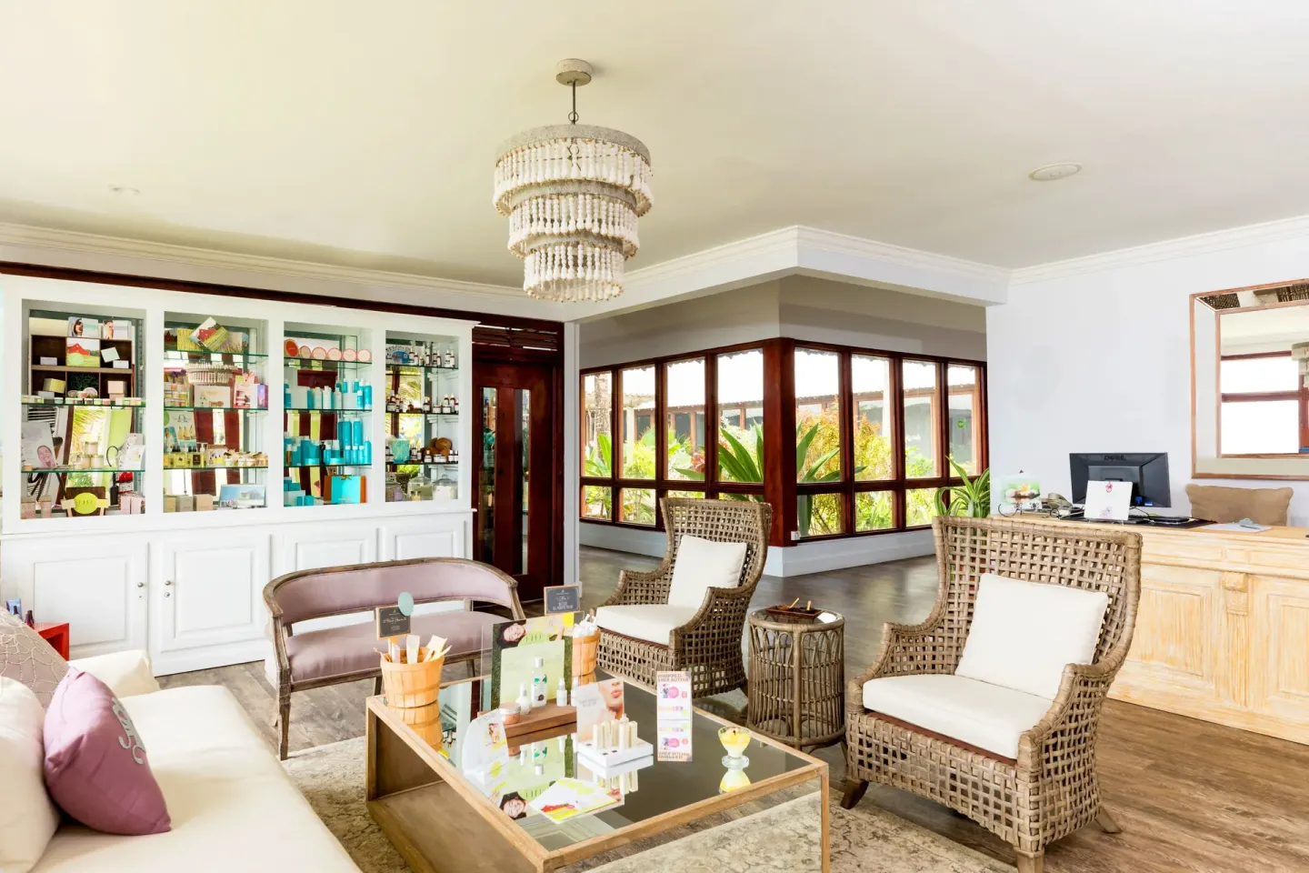 Spa reception lounge with product displays at Coconut Bay Beach Resort & Spa.