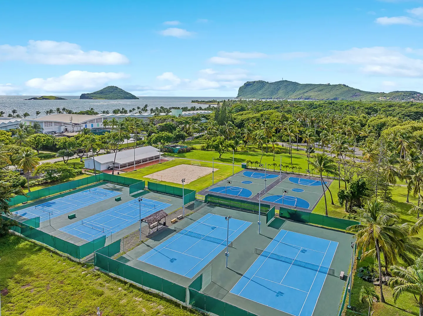 Aerial view of sports courts and resort grounds at Coconut Bay Beach Resort & Spa.