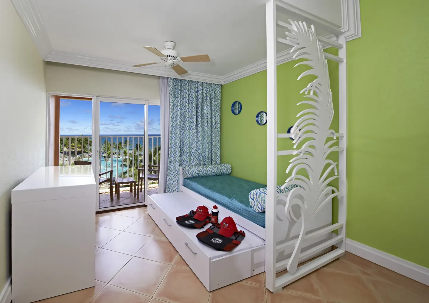 Splash Concierge Premium Oceanview sitting area at Coconut Bay Beach Resort & Spa with daybed and balcony.