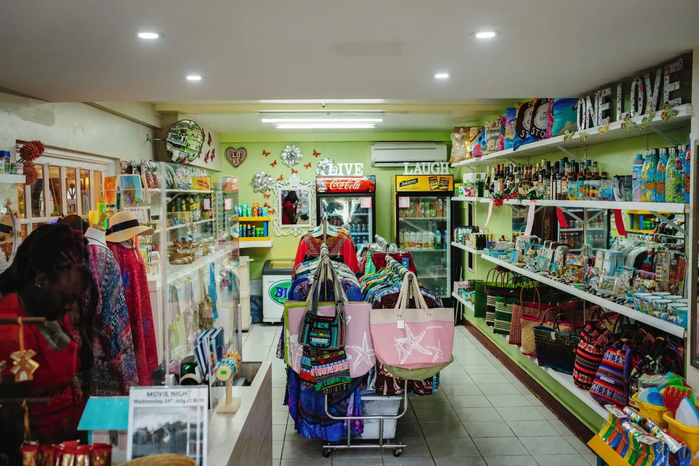 Colorful resort shop with clothing, bags, drinks, and souvenirs at Coconut Court Beach Hotel.