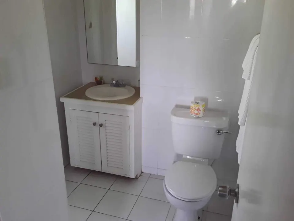 Bathroom in a two-bedroom annex apartment at Coconut Court Beach Hotel.