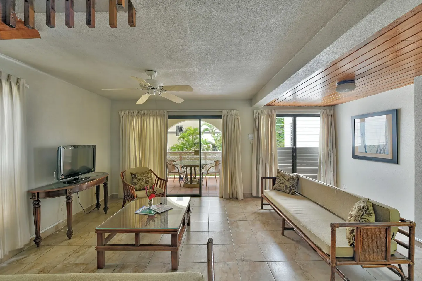 Living room of a two-bedroom annex apartment at Coconut Court Beach Hotel.