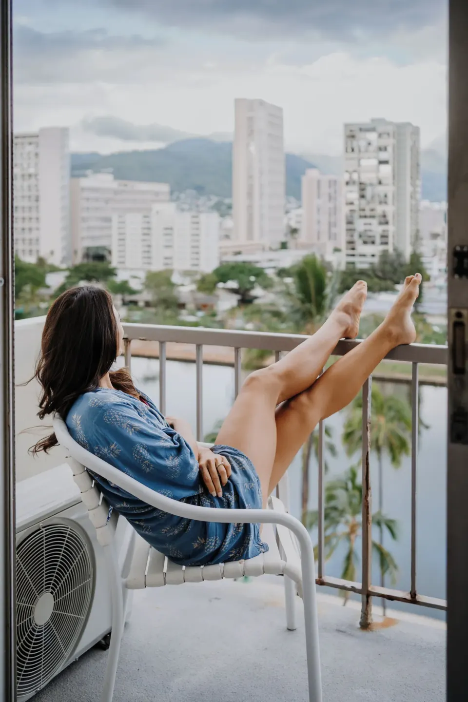 Standard Room City View balcony seating at Coconut Waikiki Hotel.