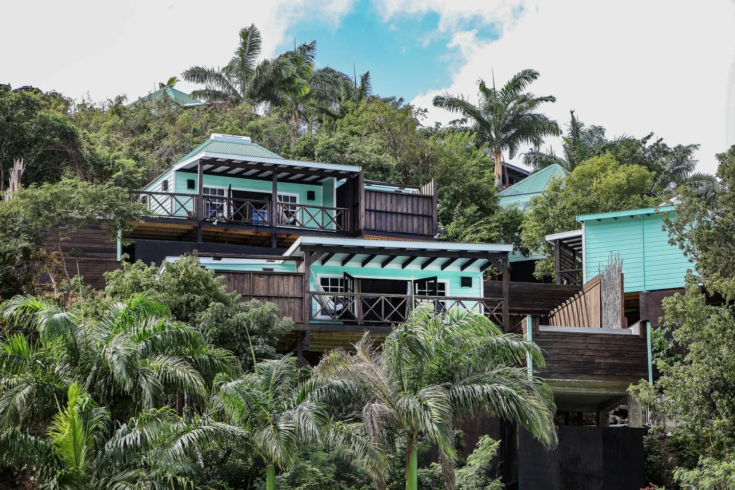 Bay View Pool Cottage exteriors on a tropical hillside at COCOS Hotel.