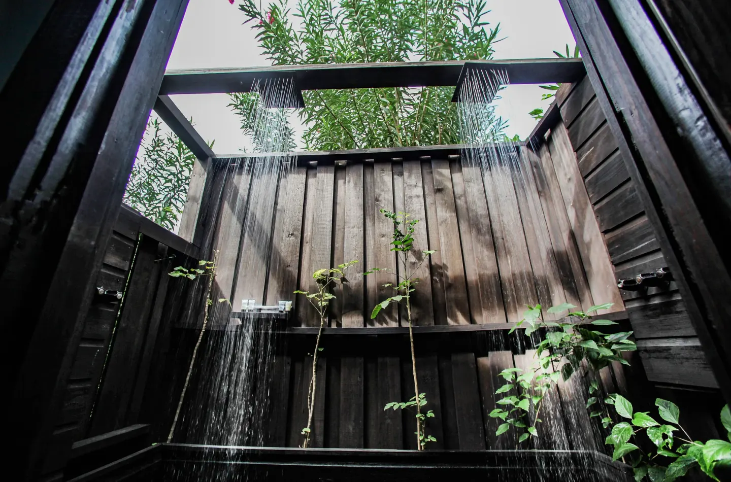 Open-air double shower in a Beach Front Pool Cottage at COCOS Hotel.