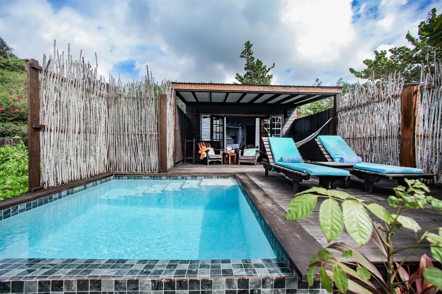 Beach Front Pool Cottage plunge pool with loungers at COCOS Hotel.