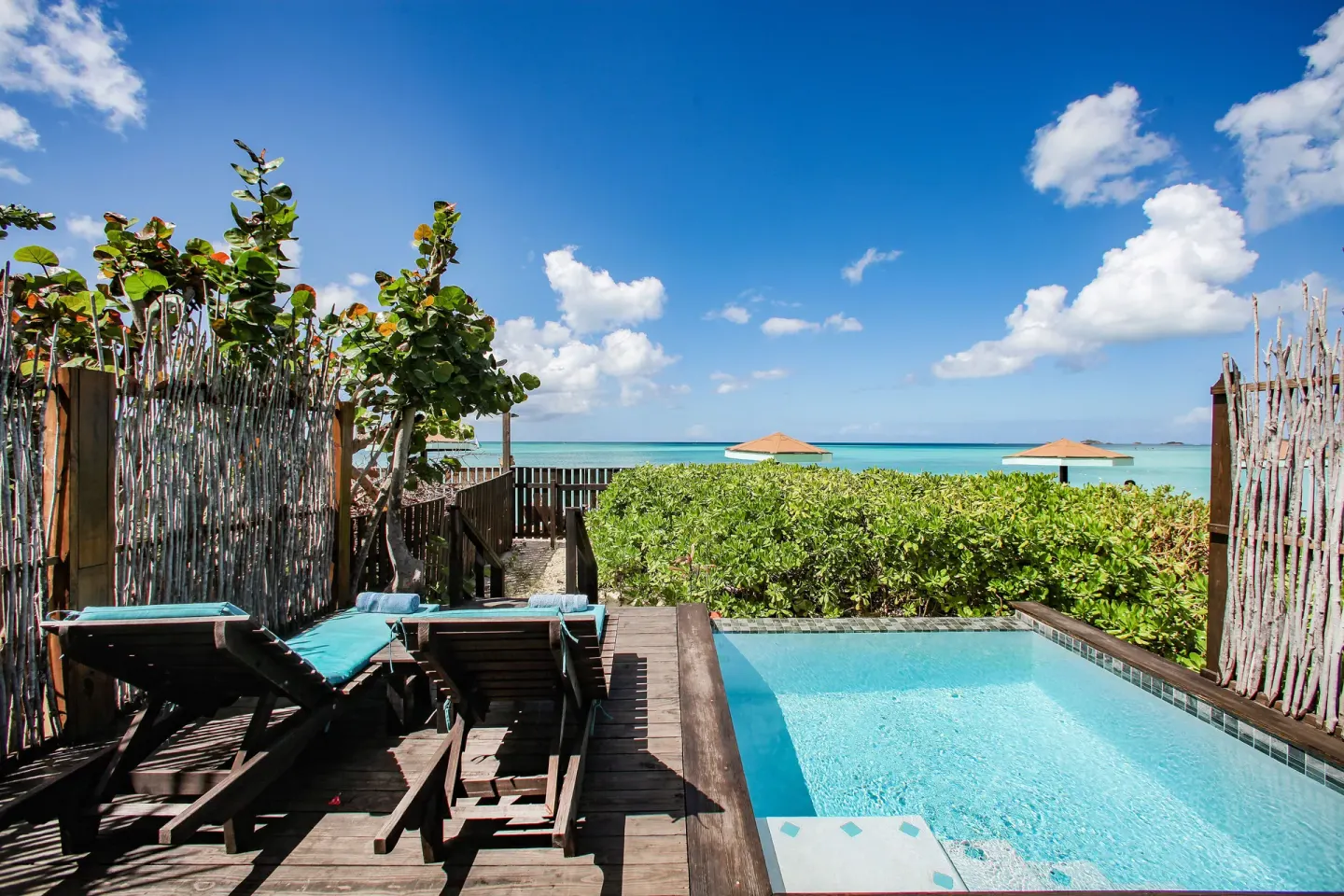 Beach Front Pool Cottage pool deck with sea view at COCOS Hotel.