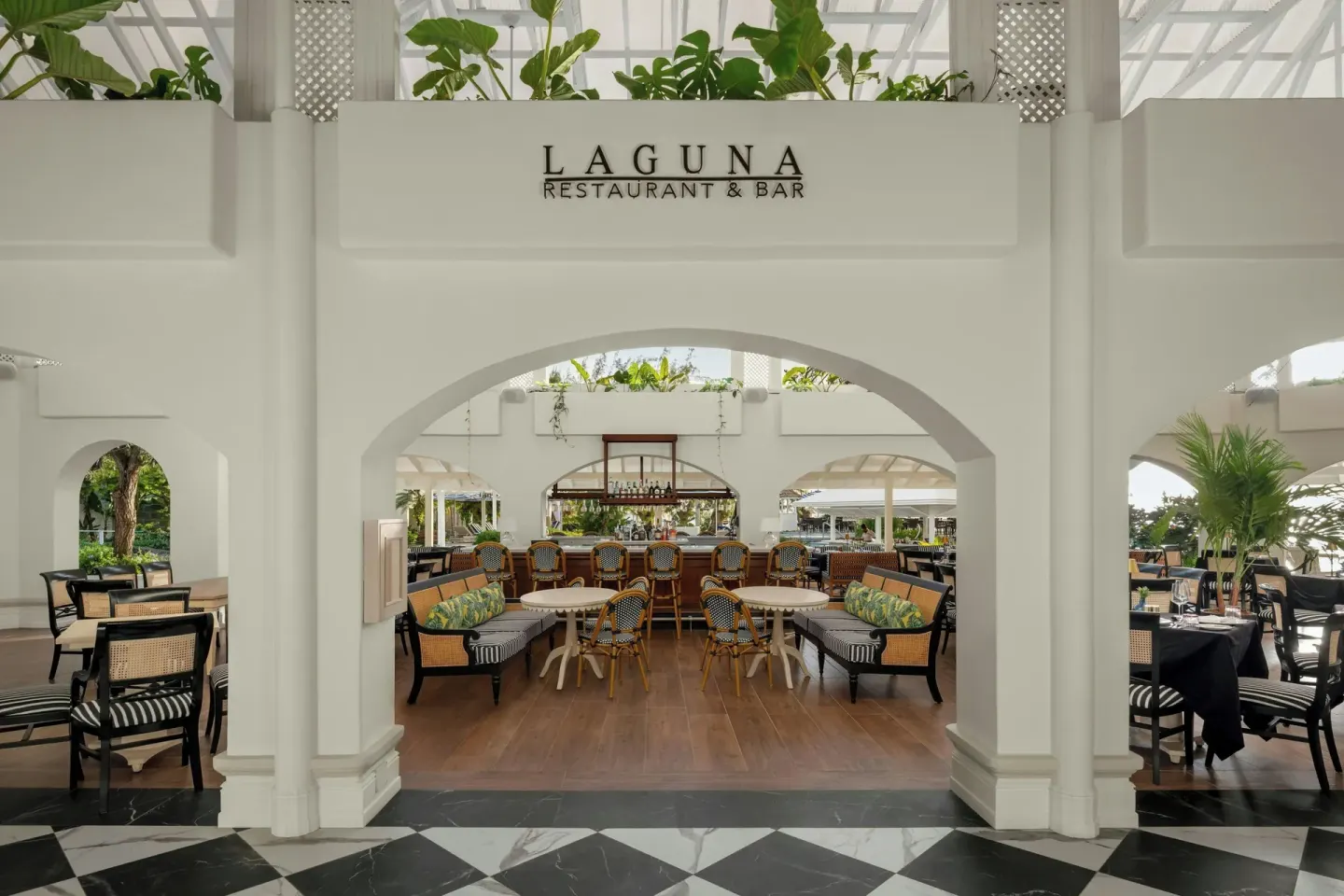 Laguna Restaurant & Bar entrance with seating and bar at Colony Club, Barbados.