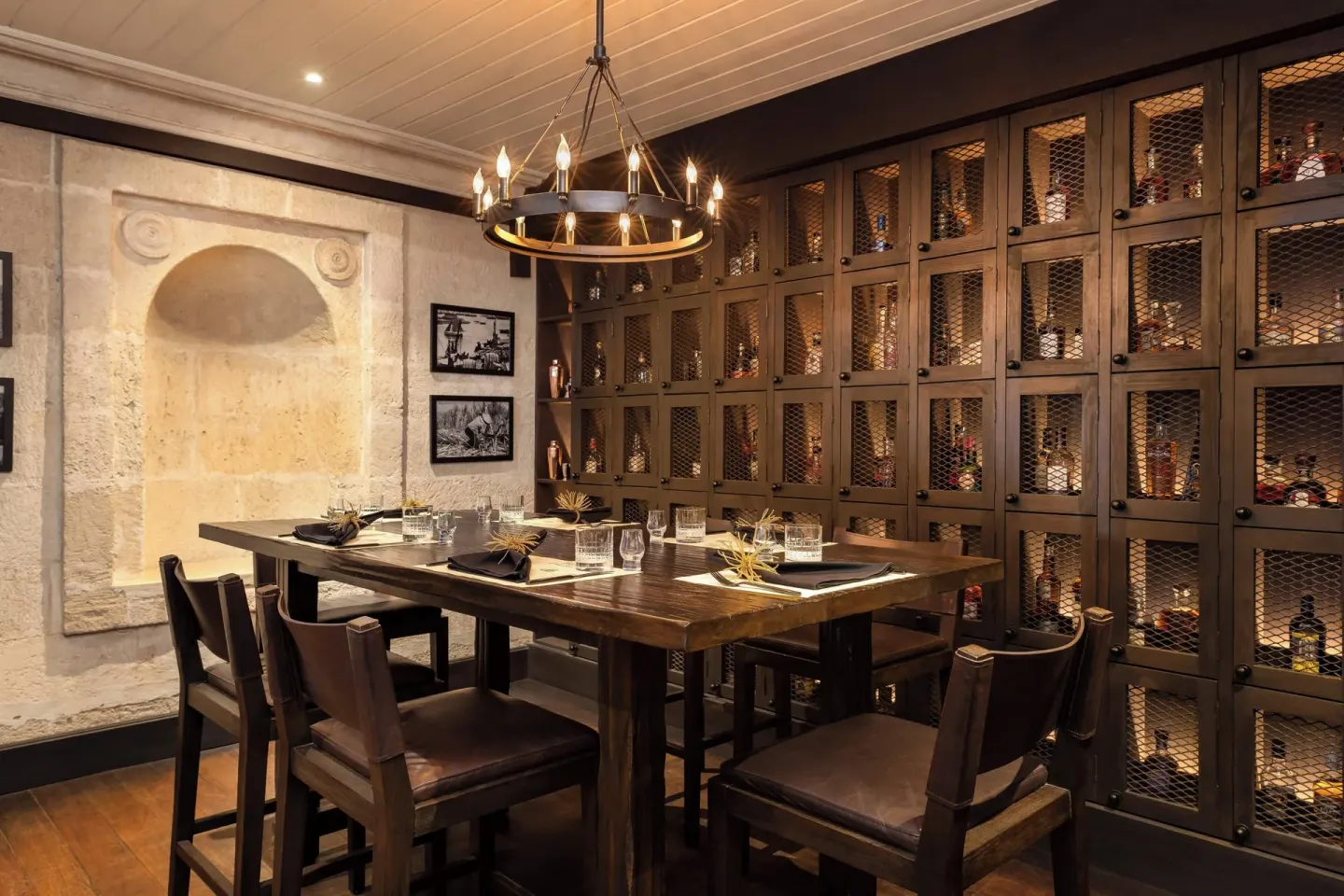 Rum tasting room with a high table and bottle cabinets at Colony Club, Barbados.