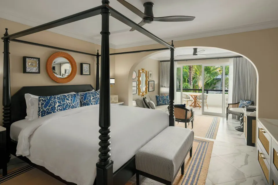 Junior Suite with four-poster bed and balcony garden view at Colony Club, Barbados.