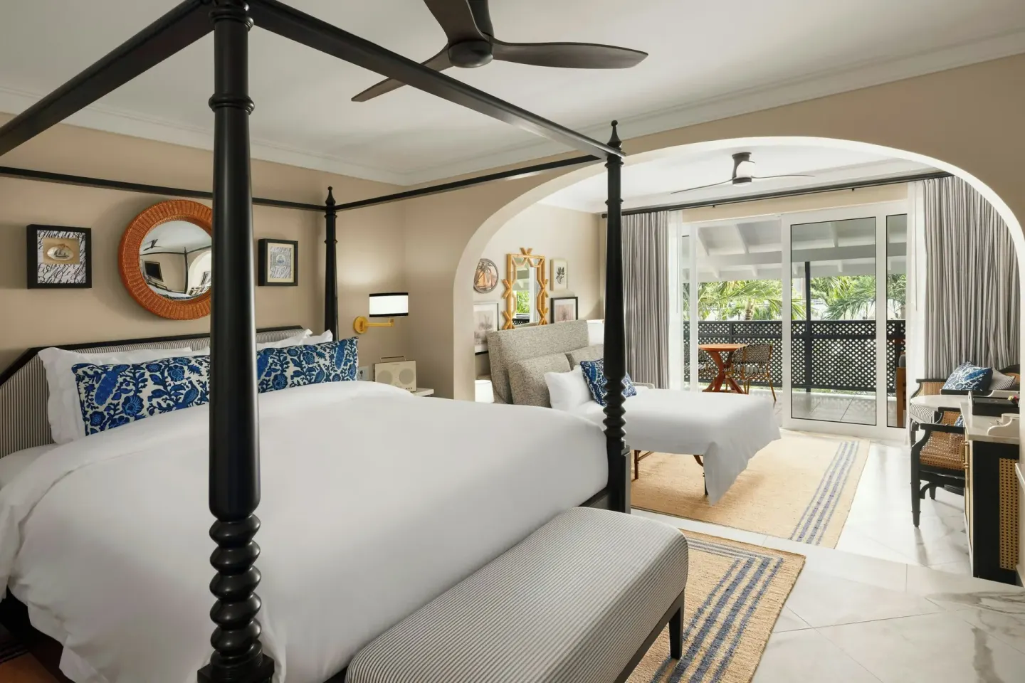 Junior Suite with four-poster bed, sitting area and balcony at Colony Club, Barbados.
