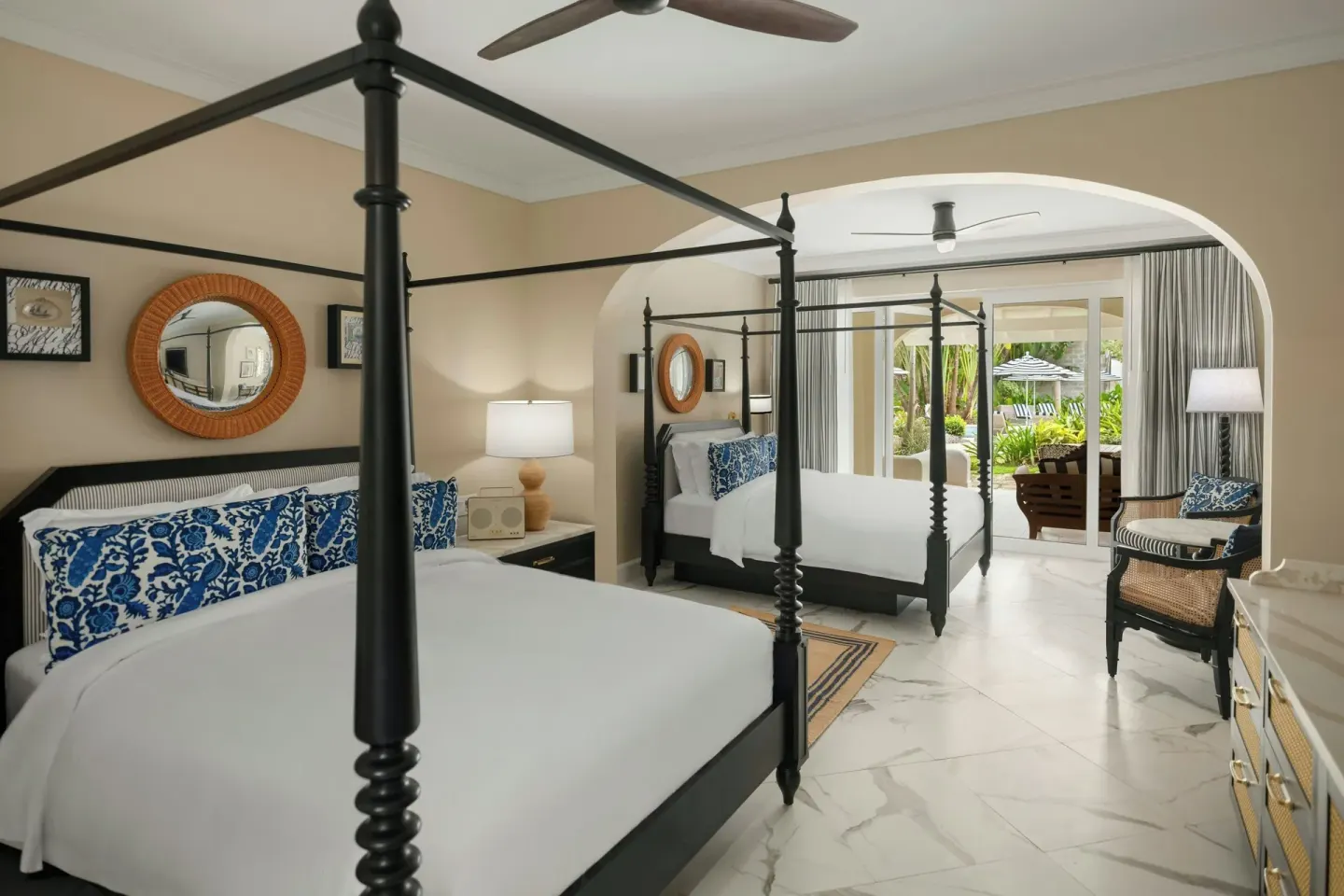 Junior Suite bedroom with two four-poster beds and terrace view at Colony Club, Barbados.