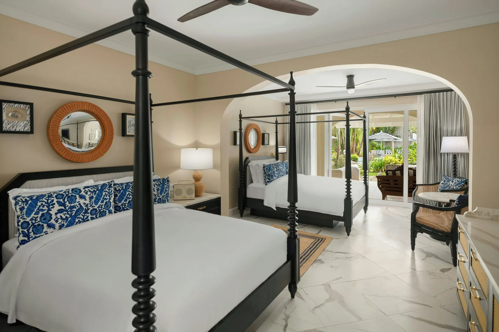 Junior Suite bedroom with two four-poster beds and terrace view at Colony Club, Barbados.