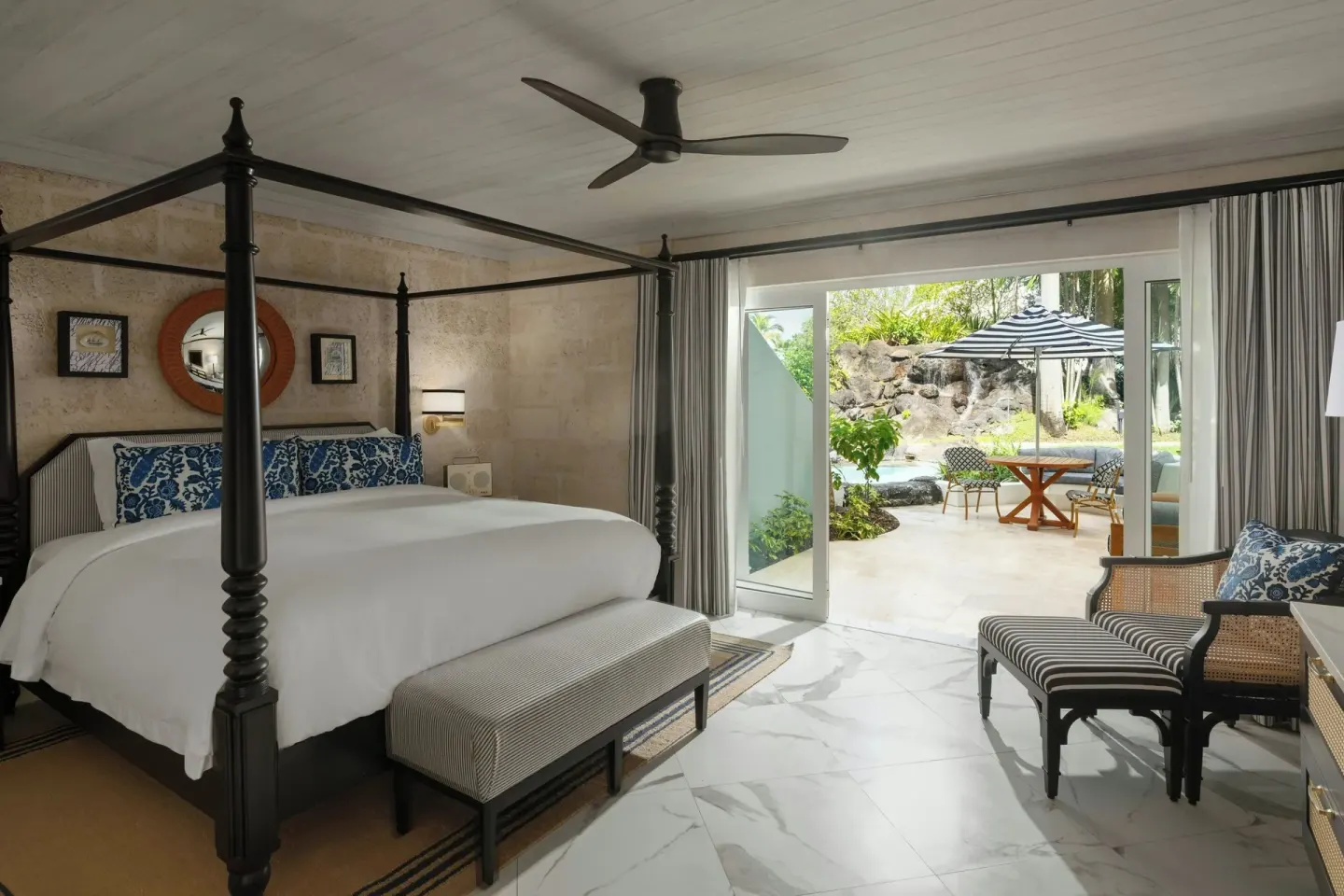 Poolside Luxury Room with four-poster king bed and terrace at Colony Club, Barbados.