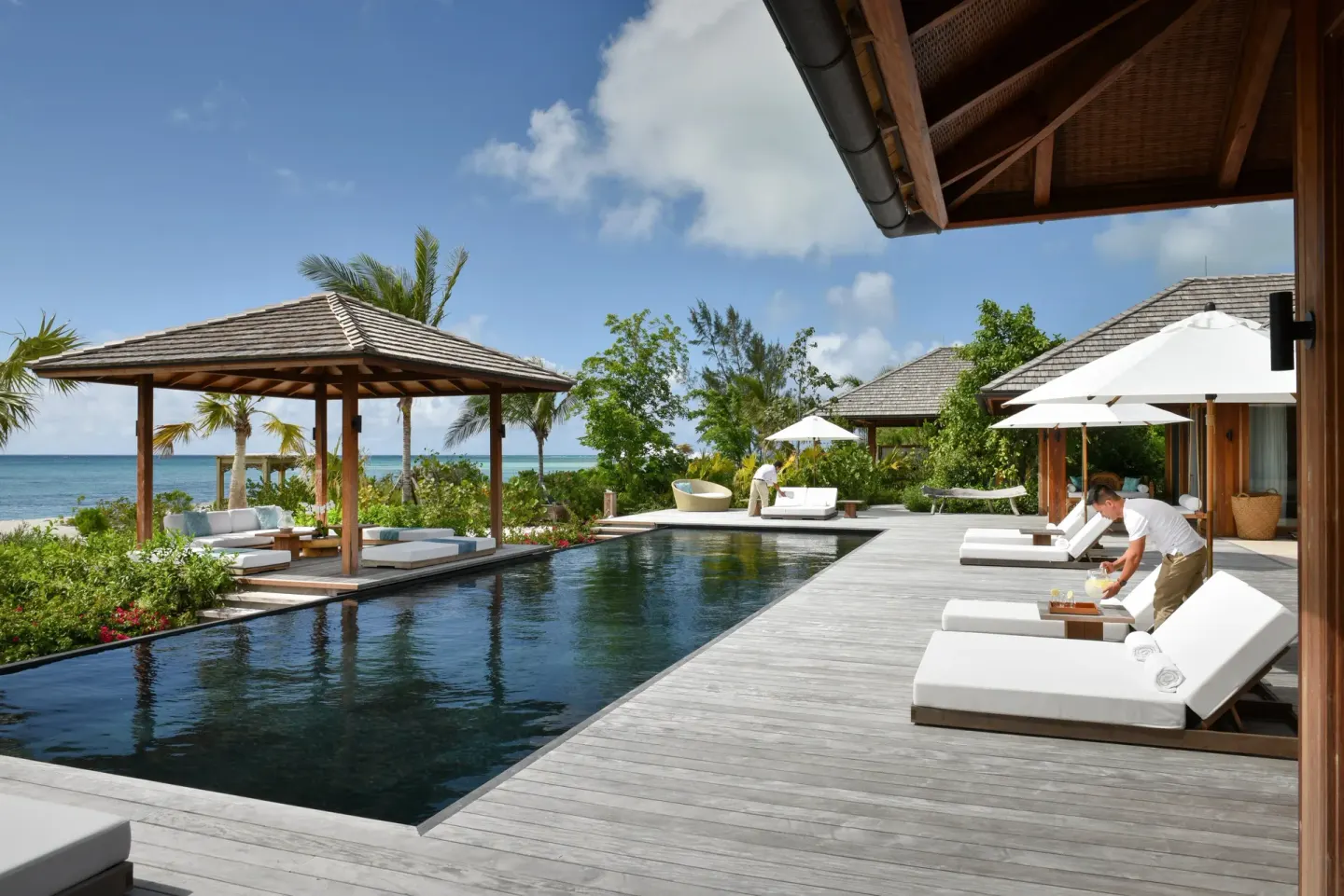 Private pool deck with cabana, loungers and ocean view at COMO Parrot Cay.