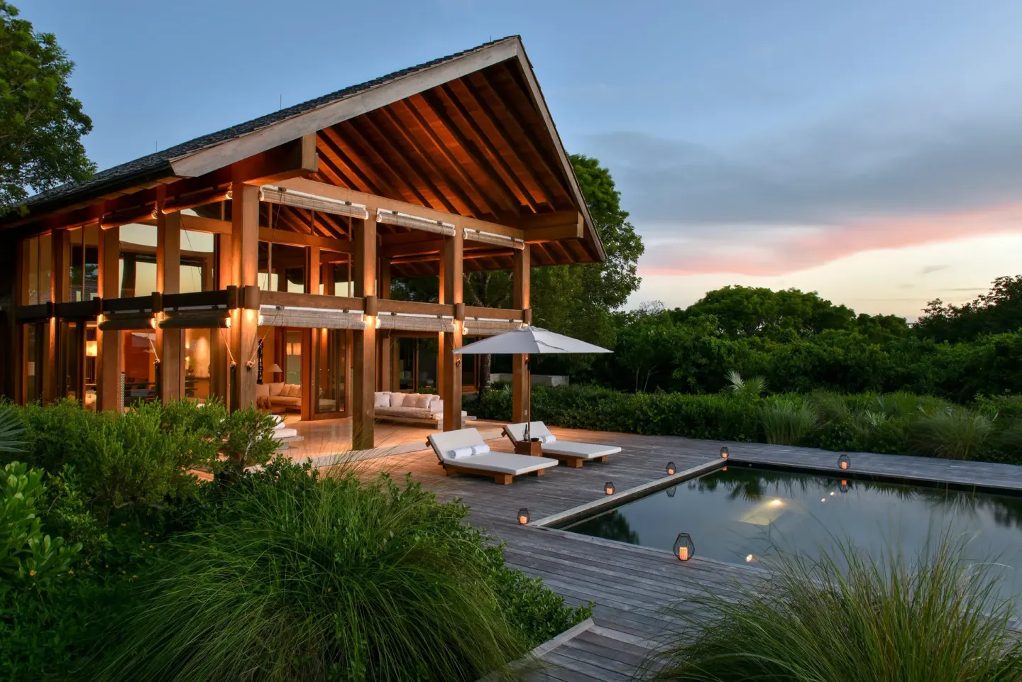 Two-story villa with private pool and deck at sunset at COMO Parrot Cay.