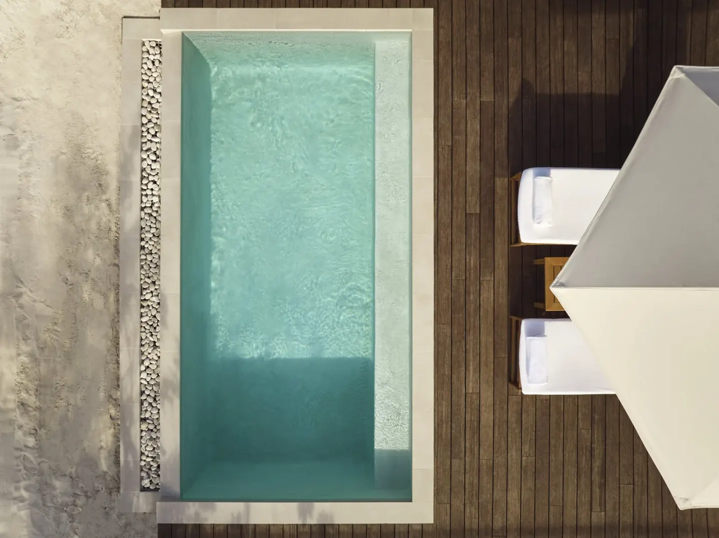 Beachfront Suite plunge pool and deck viewed from above at COMO Parrot Cay.