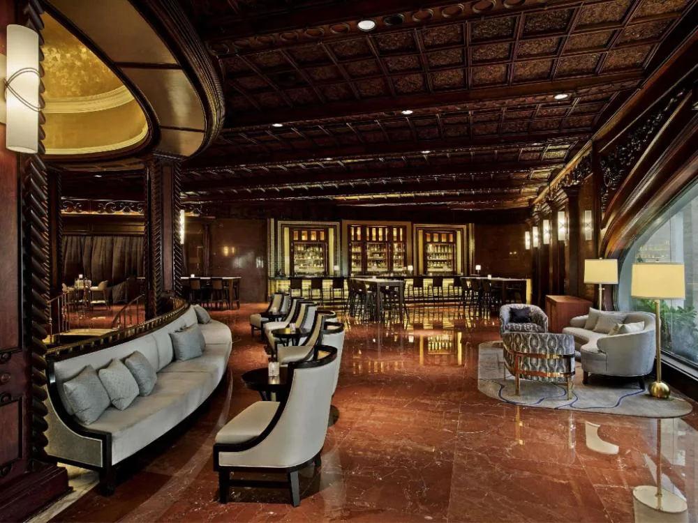 Fairmont El San Juan Hotel historic luxury Isla Verde beach resort with grand lobby details and tropical pool area in San Juan, Puerto Rico.