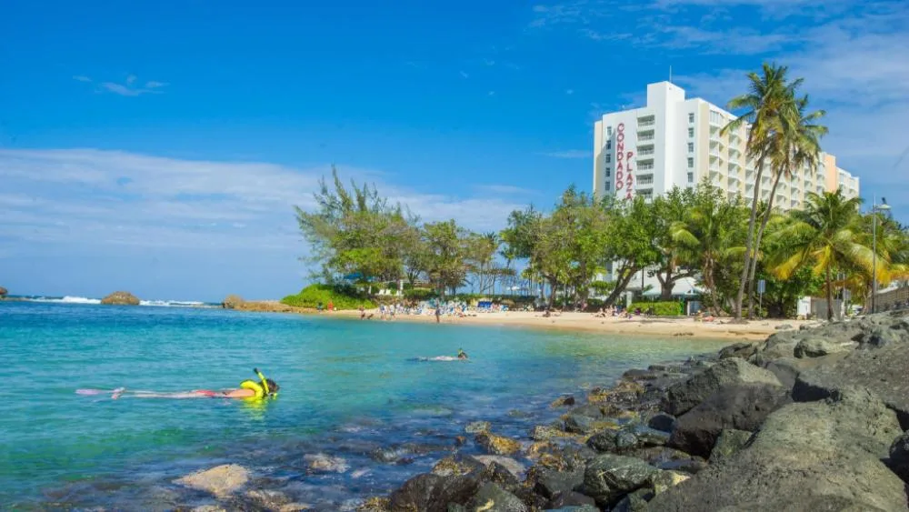 The Condado Plaza landmark Condado resort hotel with ocean and lagoon views from a waterfront tower in San Juan, Puerto Rico.
