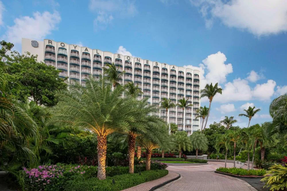 The Royal Sonesta San Juan upscale Isla Verde beachfront resort hotel with oceanfront pool and palm trees in San Juan, Puerto Rico.