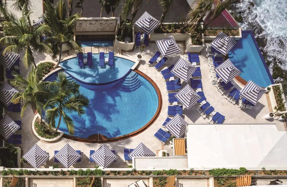 Aerial view of the oceanfront pool deck at Condado Vanderbilt Hotel.