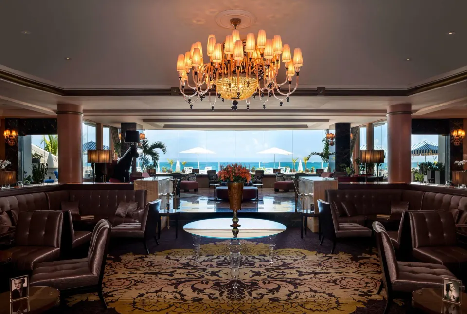Elegant lounge seating with ocean views at Condado Vanderbilt Hotel.