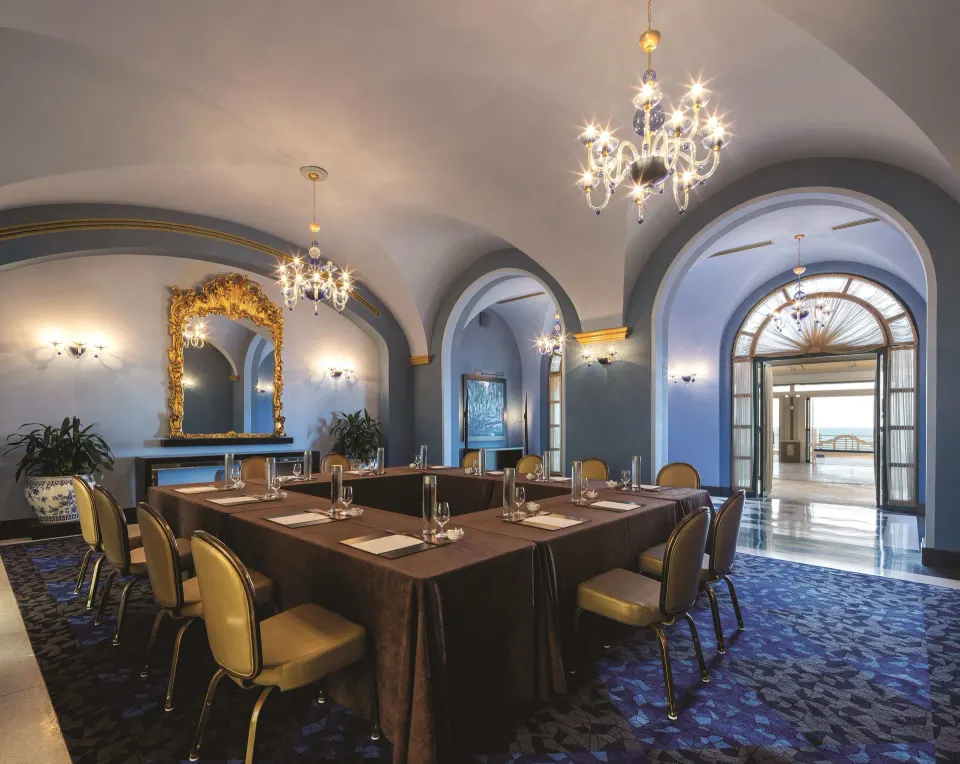 Private dining room with arched ceilings and chandeliers at Condado Vanderbilt Hotel.