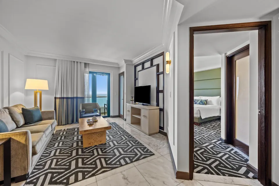 Biltmore Ocean View One-Bedroom Suite living room and bedroom doorway at Condado Vanderbilt Hotel.