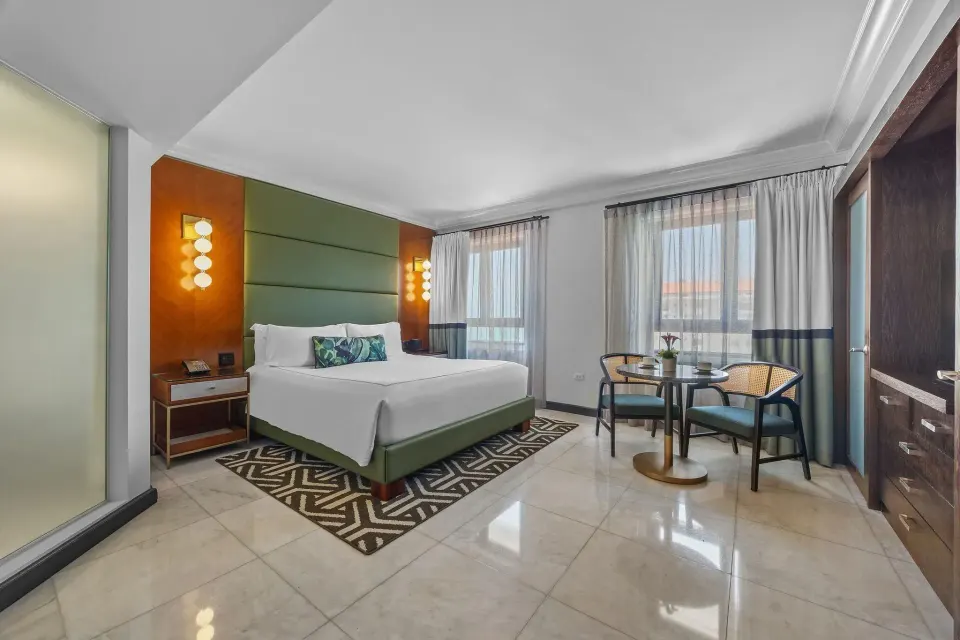 City View Tower Room with king bed and seating area at Condado Vanderbilt Hotel.