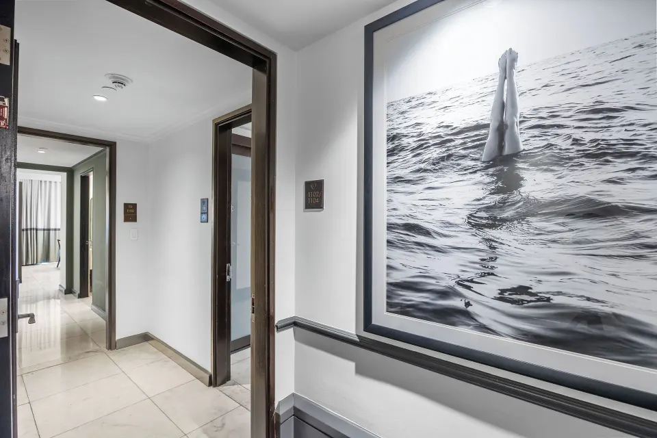 Hallway artwork in the Commodore City View Two-Bedroom Room at Condado Vanderbilt Hotel.