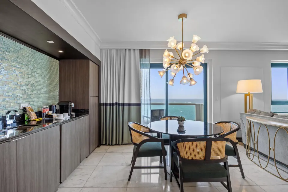 Terrace Oceanfront One-Bedroom Room dining area and wet bar at Condado Vanderbilt Hotel.