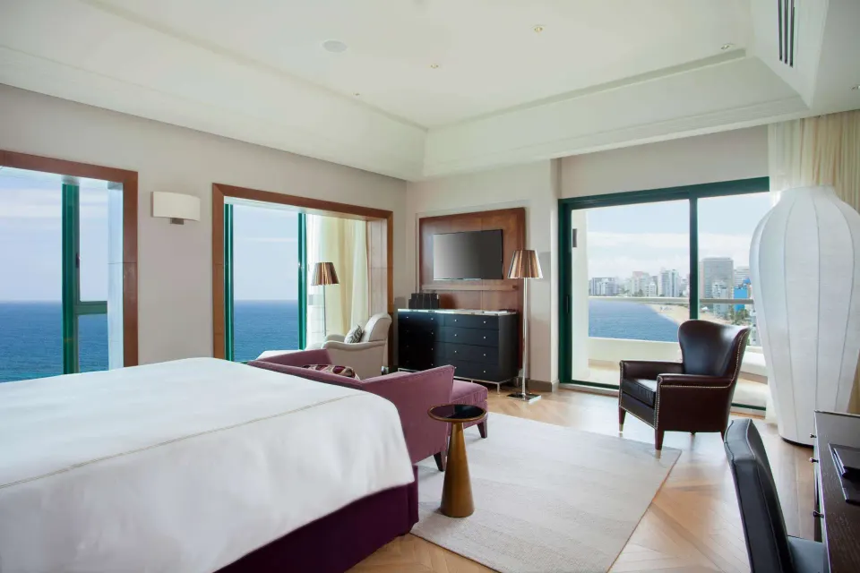 Ocean-view bedroom with king bed in the Vanderbilt Oceanfront Two-Bedroom Suite at Condado Vanderbilt Hotel.