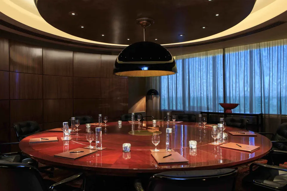 Round boardroom table with place settings at Condado Vanderbilt Hotel.