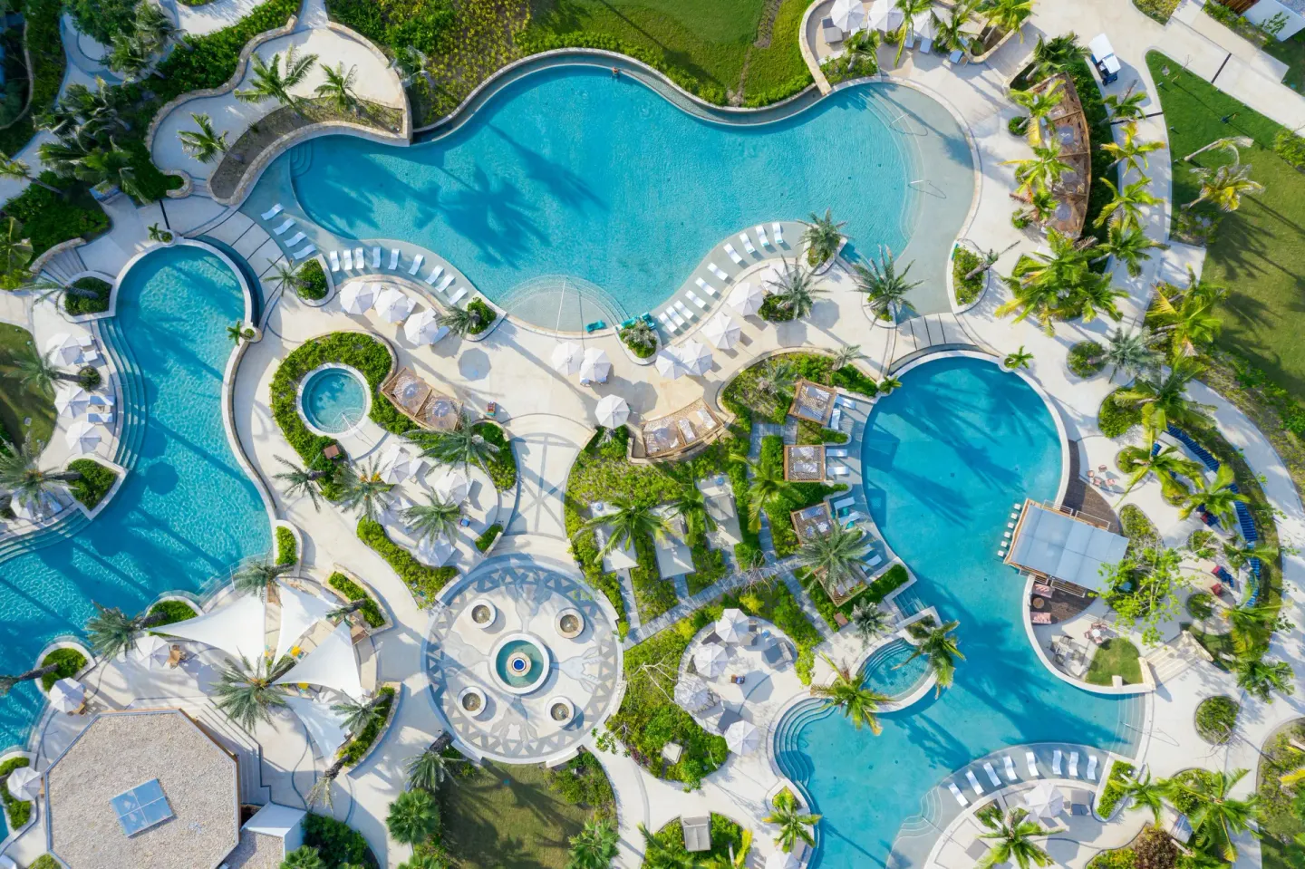 Overhead view of winding resort pools and loungers at Conrad Punta de Mita.