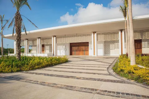 Modern resort entrance with palms and landscaping at Conrad Punta de Mita.