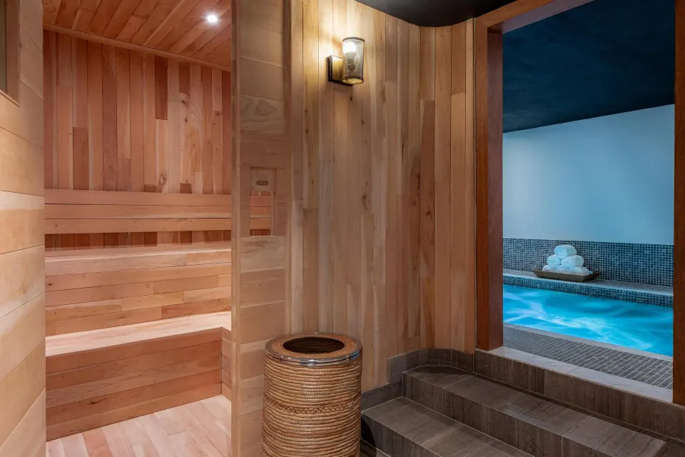 Wood-lined sauna beside a blue plunge pool at Conrad Punta de Mita.