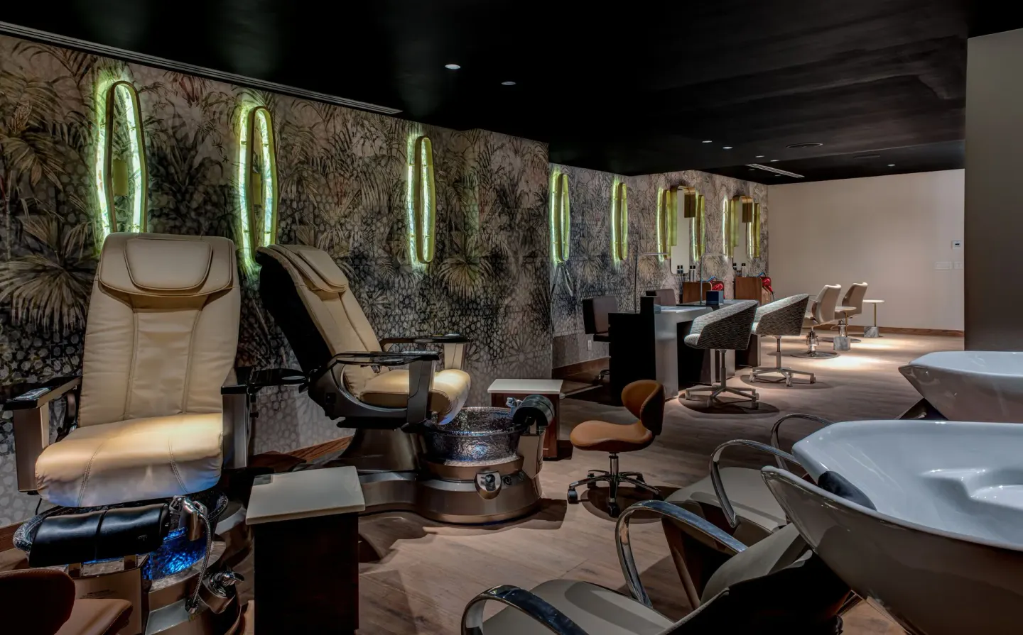 Salon area with pedicure chairs, mirrors, and wash basins at Conrad Punta de Mita.
