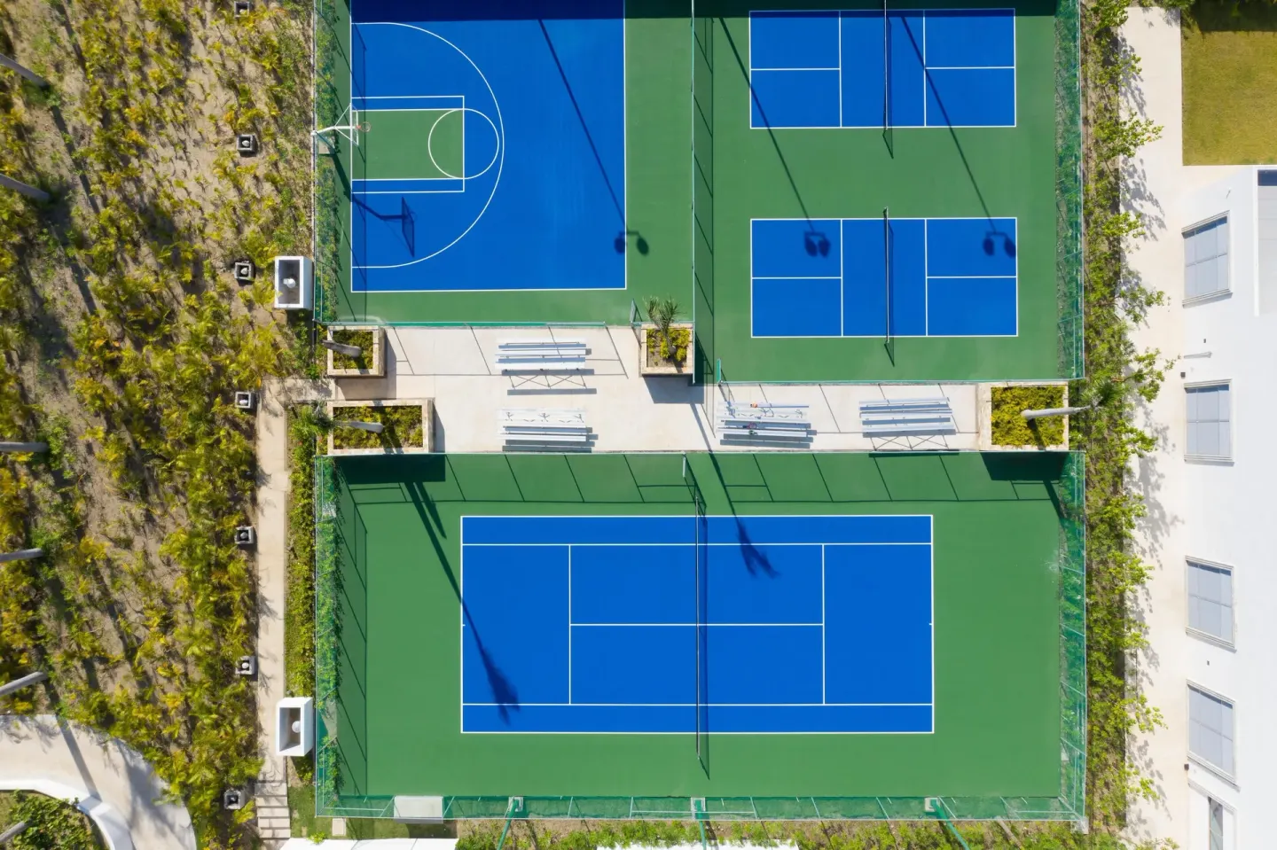 Aerial view of tennis, pickleball, and basketball courts at Conrad Punta de Mita.