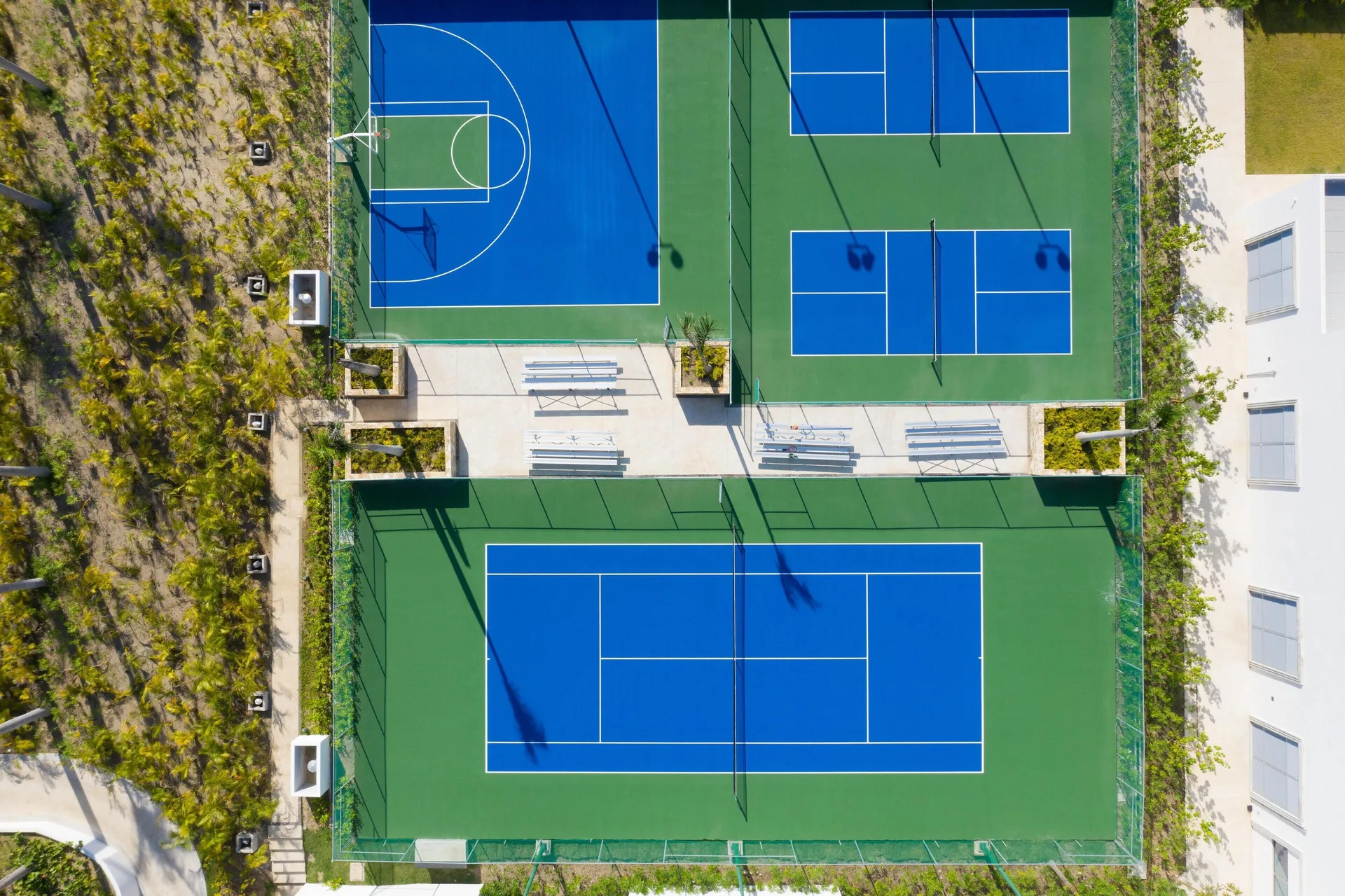 Aerial view of tennis, pickleball, and basketball courts at Conrad Punta de Mita.