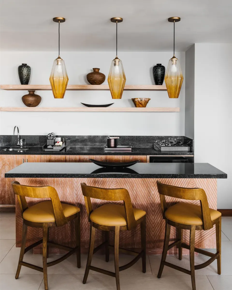 Penthouse kitchen island with bar stools at Conrad Punta de Mita.