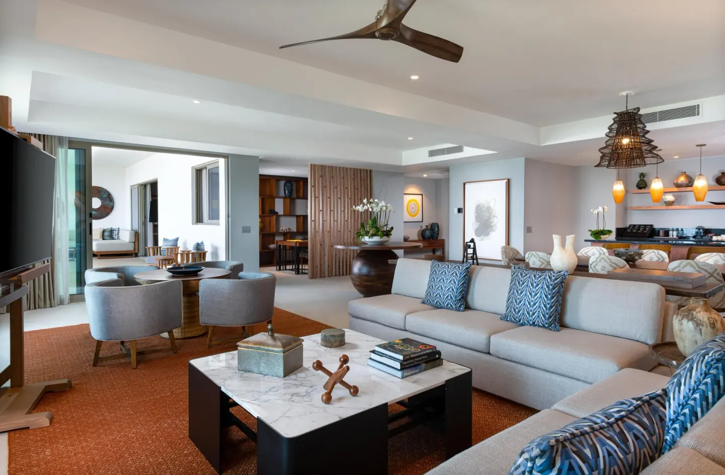 Penthouse living and kitchen area with balcony access at Conrad Punta de Mita.