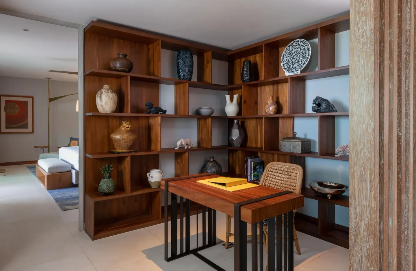 Penthouse study with wood shelving and writing desk at Conrad Punta de Mita.