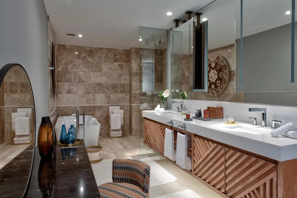 Penthouse bathroom with double vanity and soaking tub at Conrad Punta de Mita.