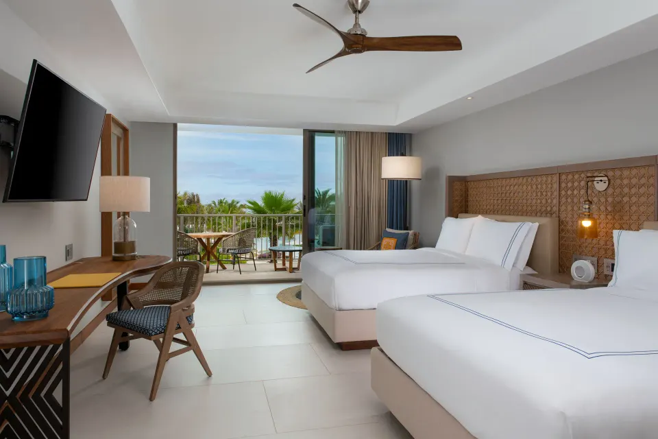 Two-bed accessible guest room with balcony at Conrad Punta de Mita.