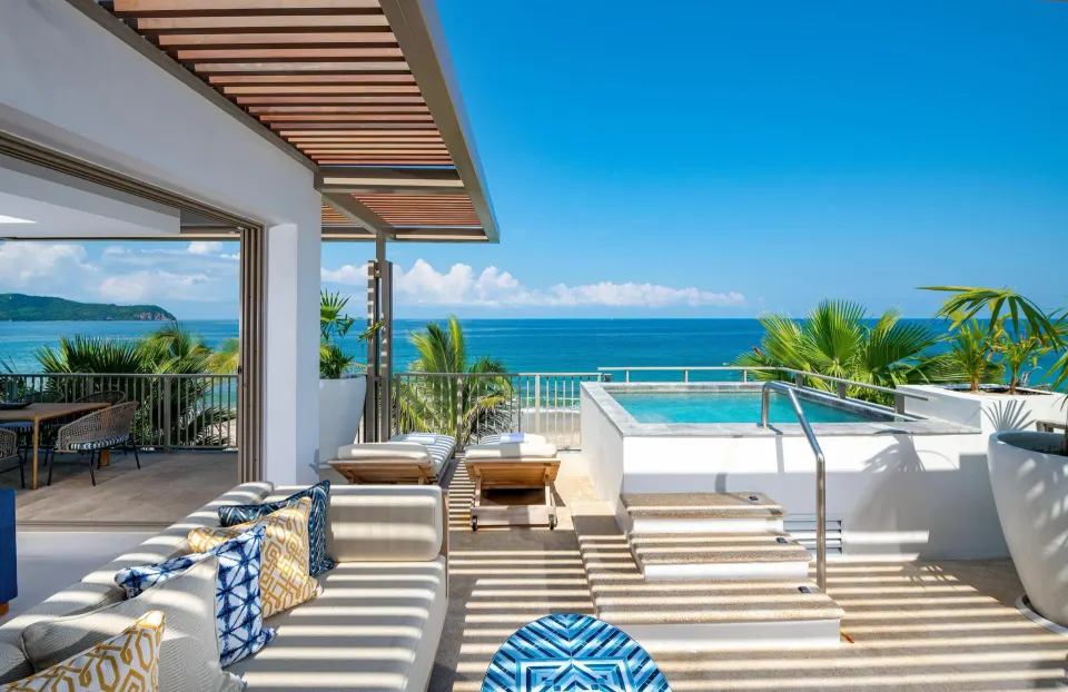 Oceanfront suite terrace with private pool, outdoor sofa, loungers, and ocean view at Conrad Punta de Mita.